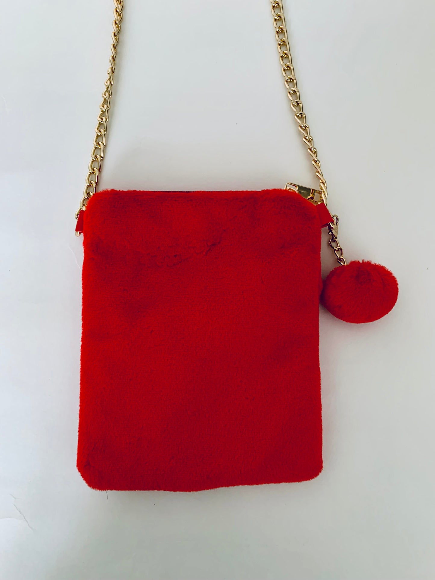 Red Crossbody Handbag with Floral Decorations and a Gold Chain