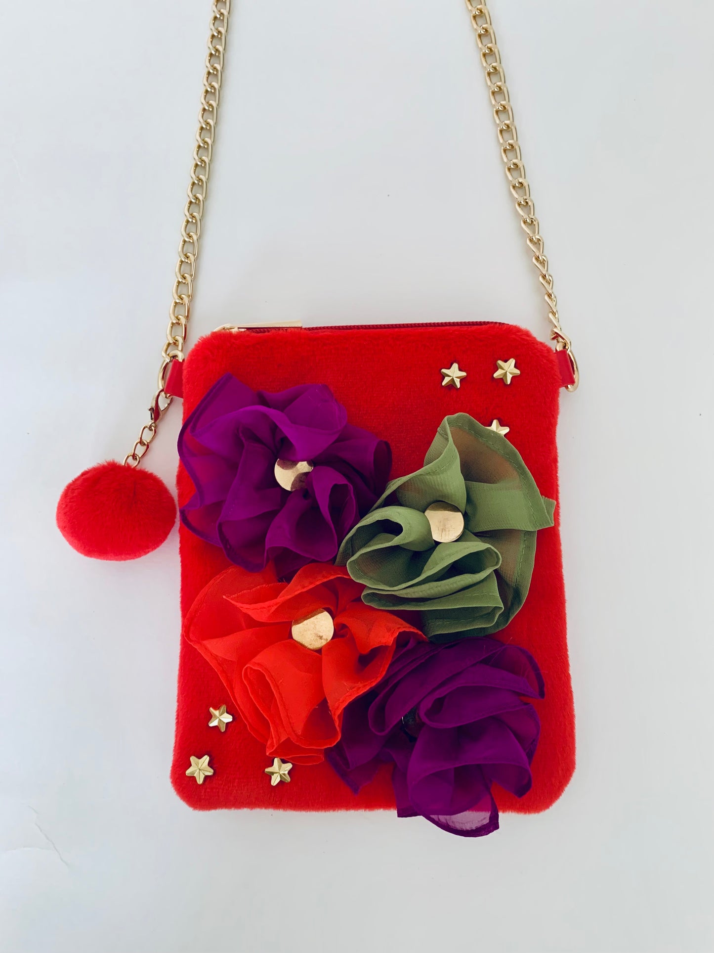Red Crossbody Handbag with Floral Decorations and a Gold Chain