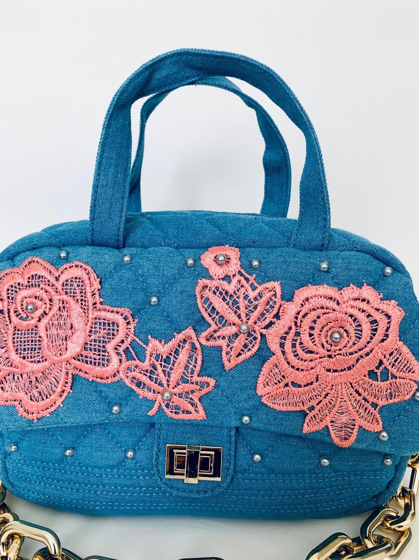 Blue Denim Handbag with Pink Lace Floral Designs and Gold Chain Strap
