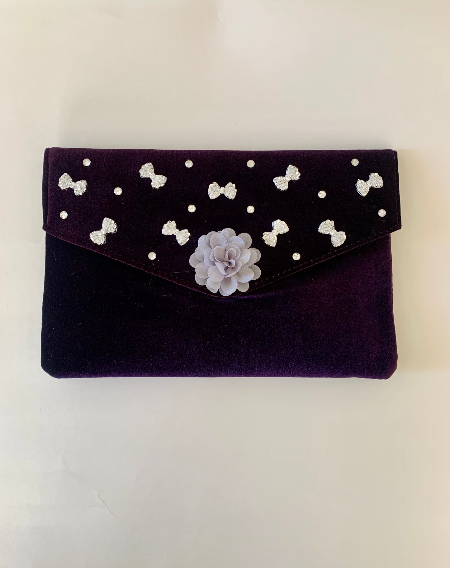 Purple Clutch Bag with Gray Floral and Bow Decorations