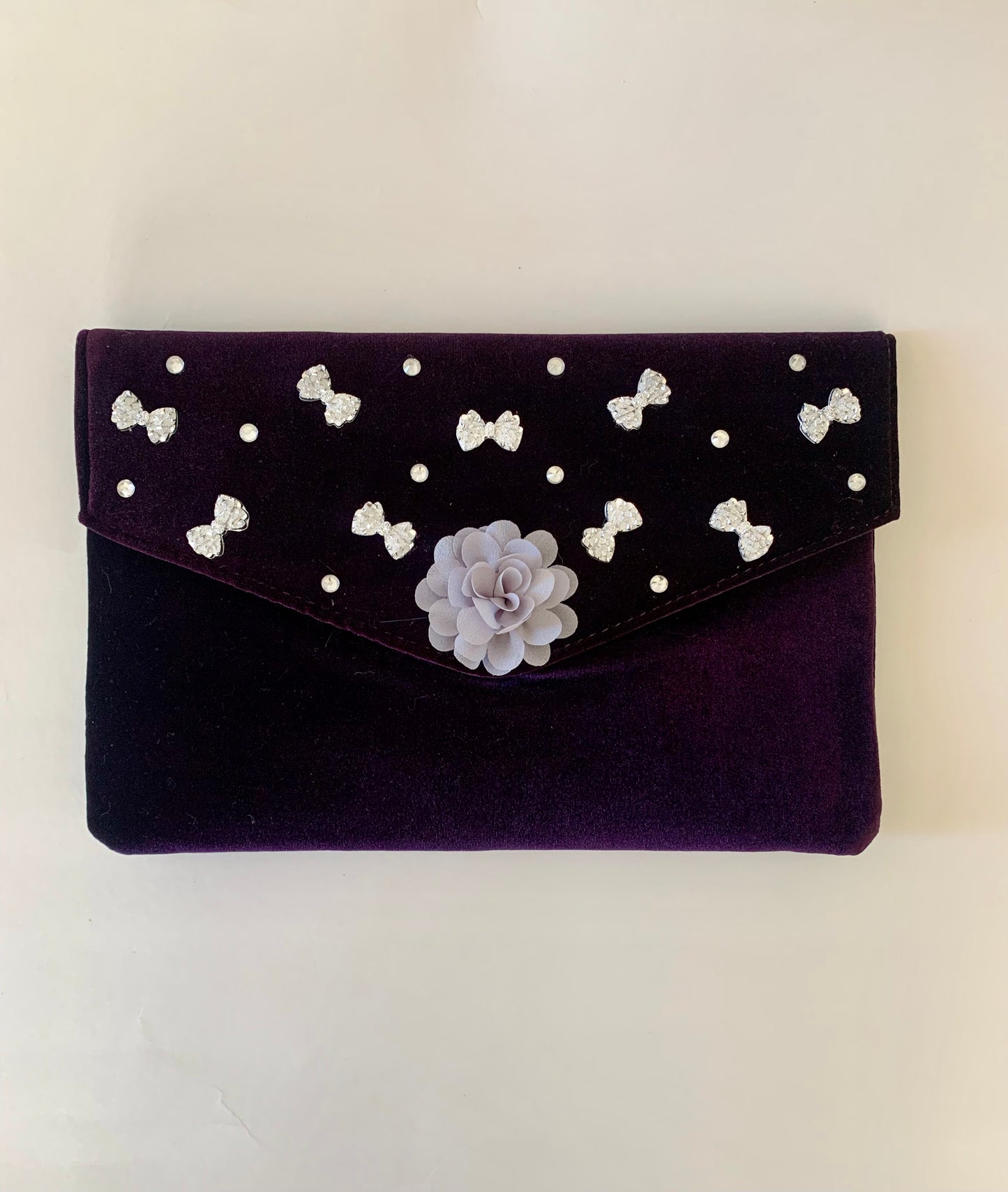 Purple Clutch Bag with Gray Floral and Bow Decorations