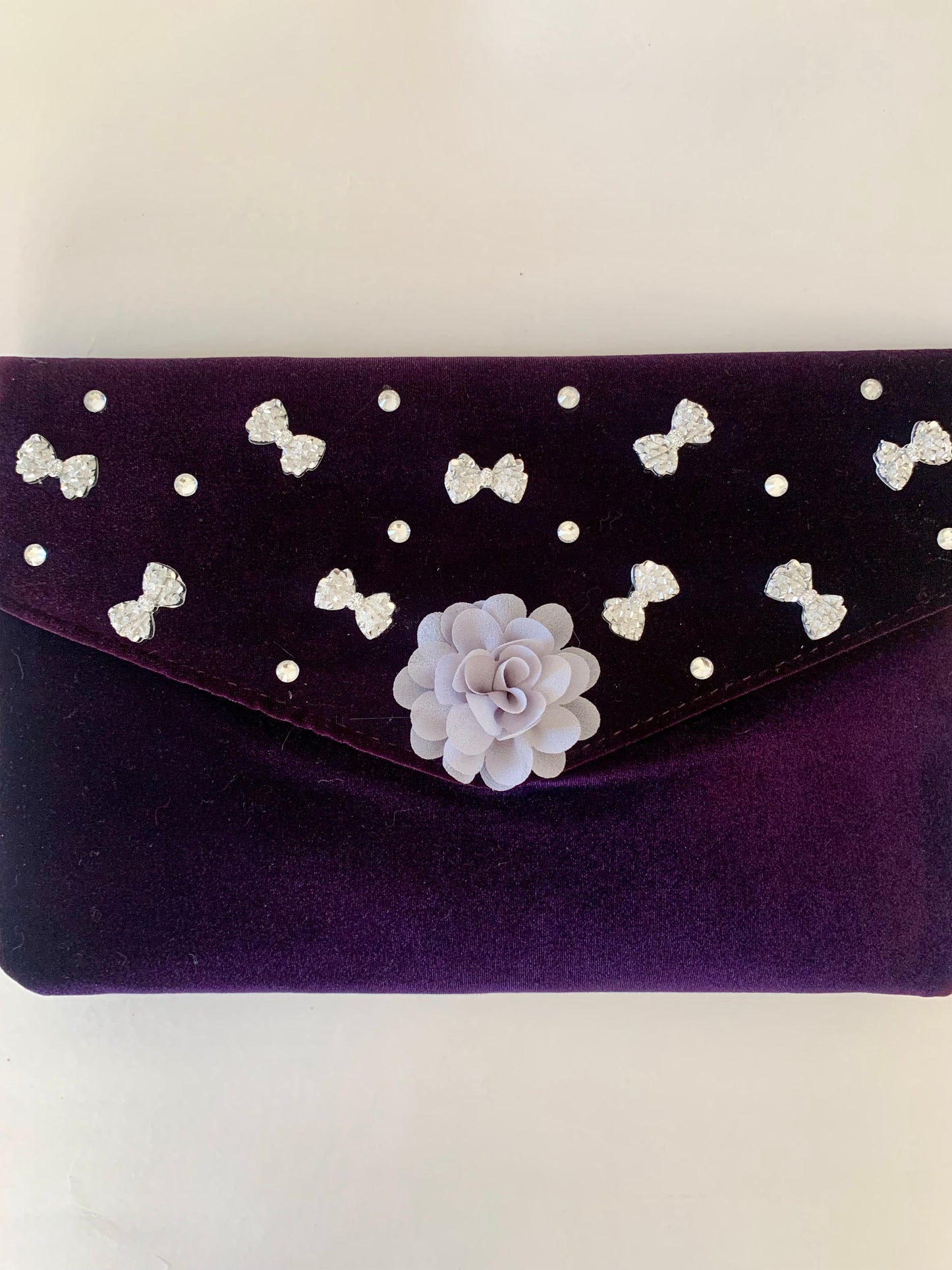 Purple Clutch Bag with Gray Floral and Bow Decorations