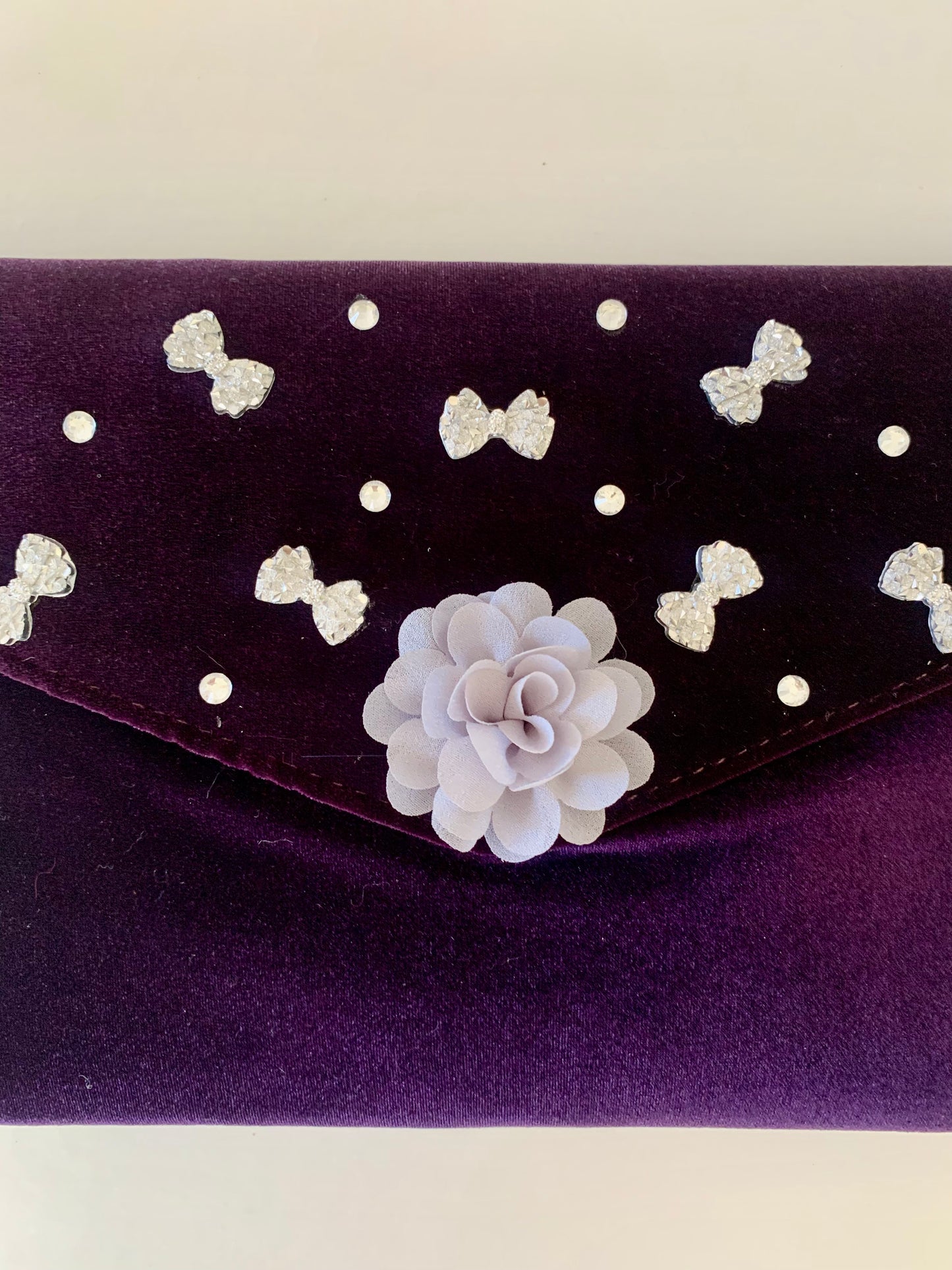 Purple Clutch Bag with Gray Floral and Bow Decorations