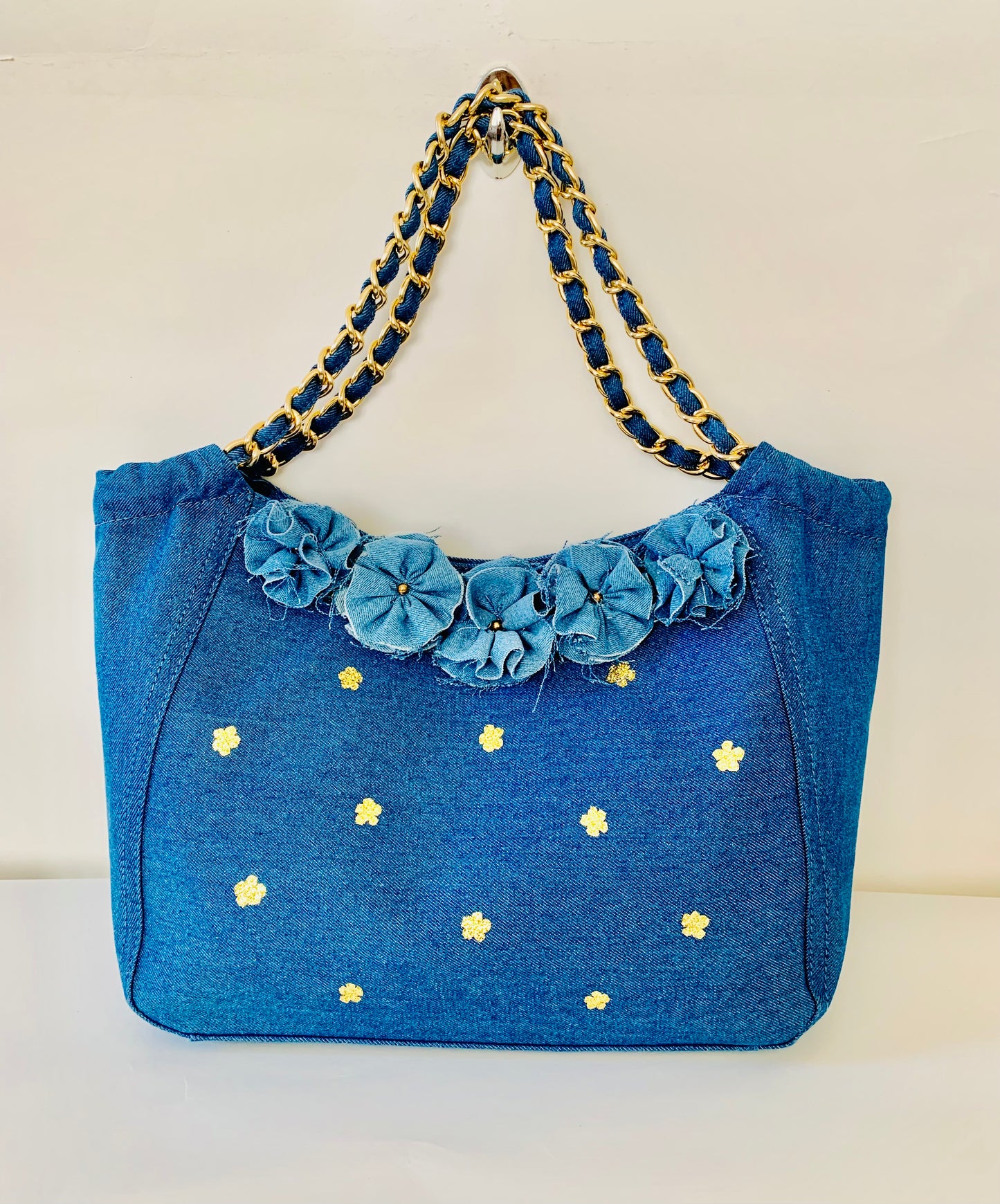 Blue Denim Handbag with Floral Details and Gold Chain Handle