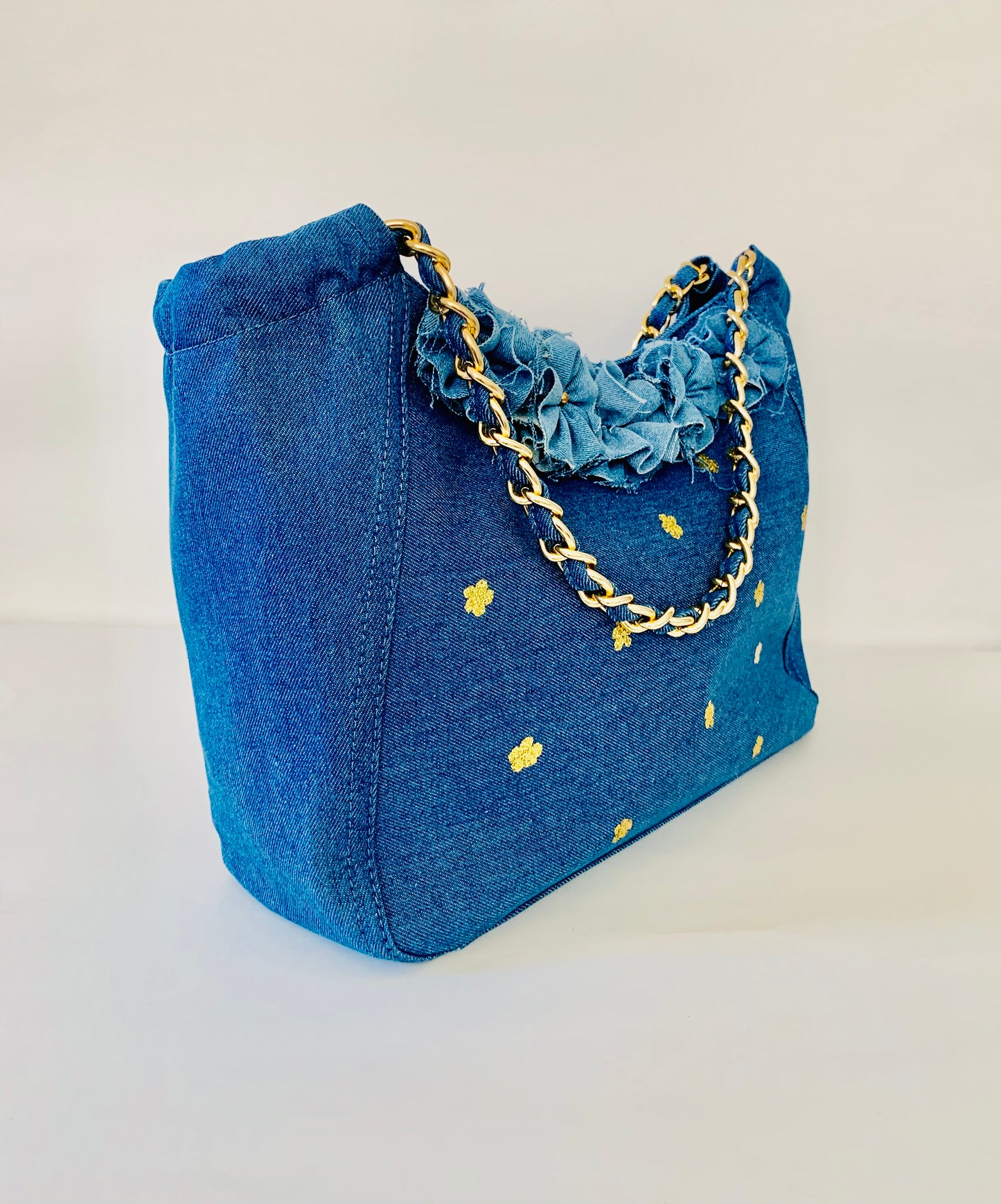 Blue Denim Handbag with Floral Details and Gold Chain Handle
