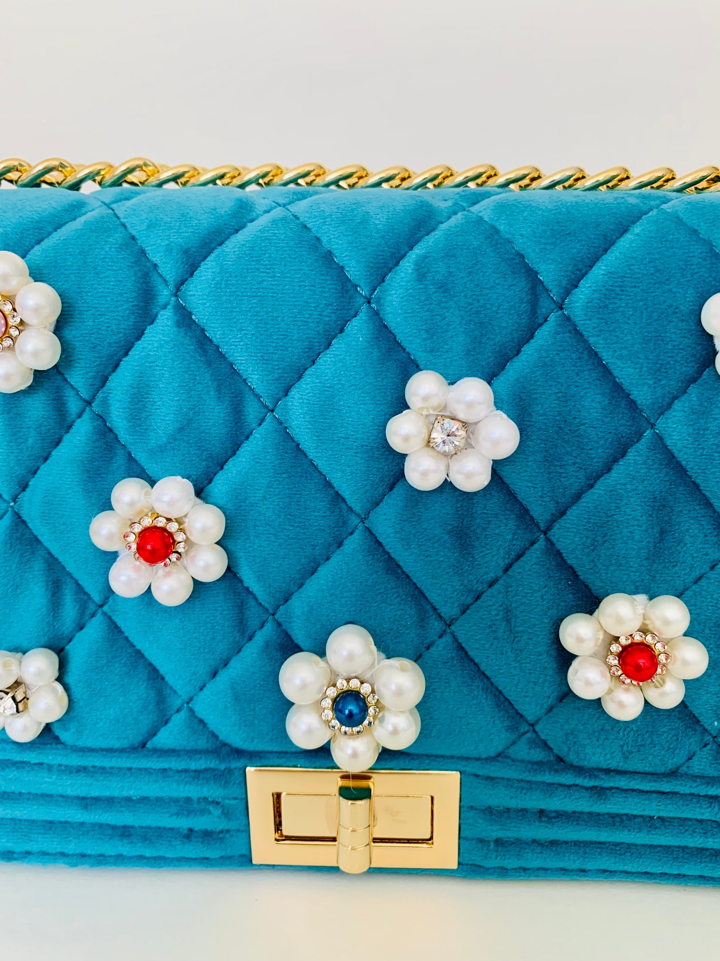 Teal Quilted Crossbody Handbag with Floral Embellishments
