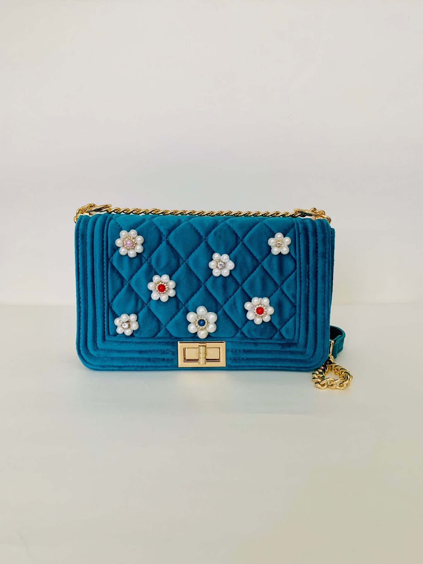 Teal Quilted Crossbody Handbag with Floral Embellishments