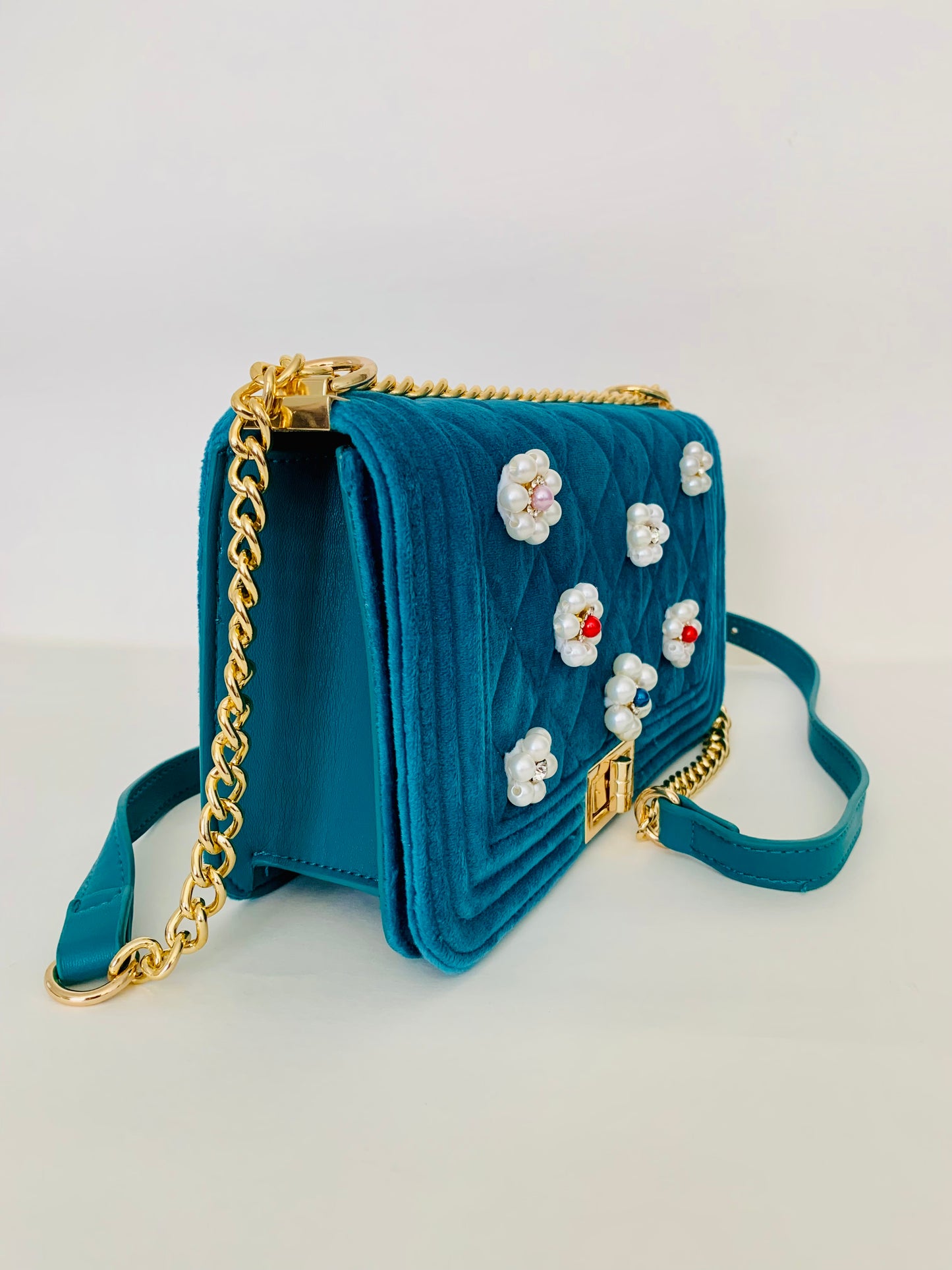 Teal Quilted Crossbody Handbag with Floral Embellishments