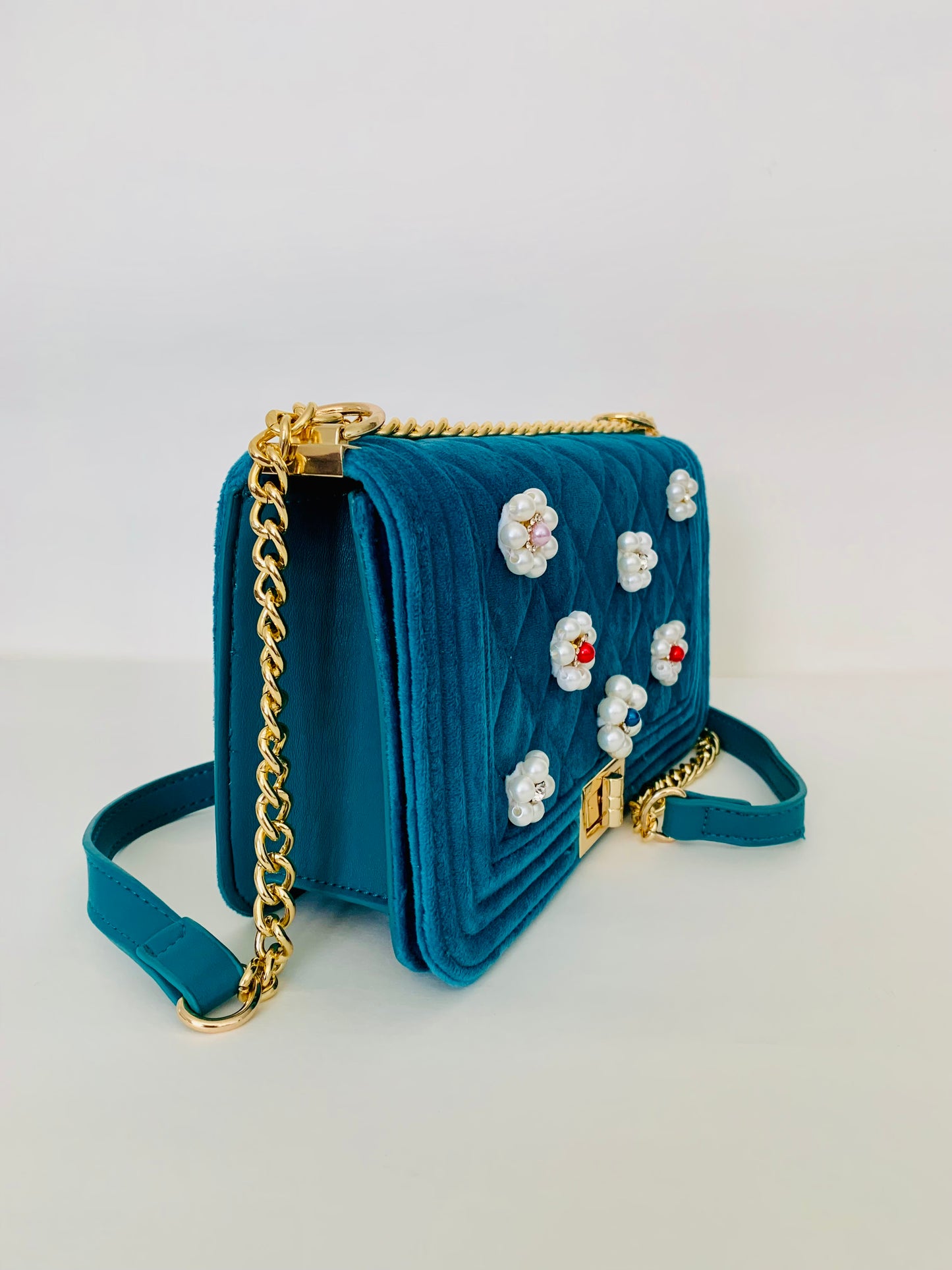 Teal Quilted Crossbody Handbag with Floral Embellishments
