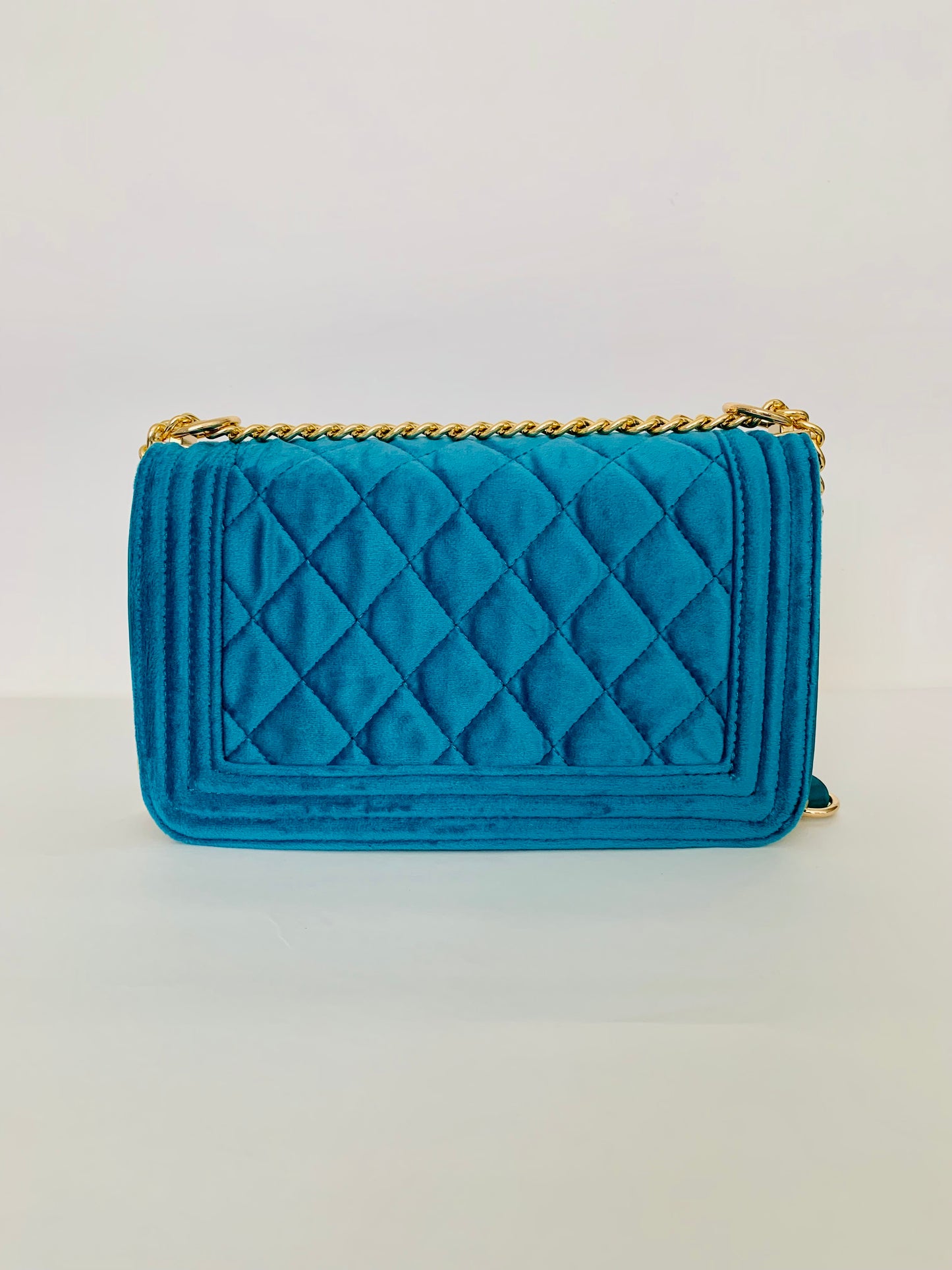 Teal Quilted Crossbody Handbag with Floral Embellishments
