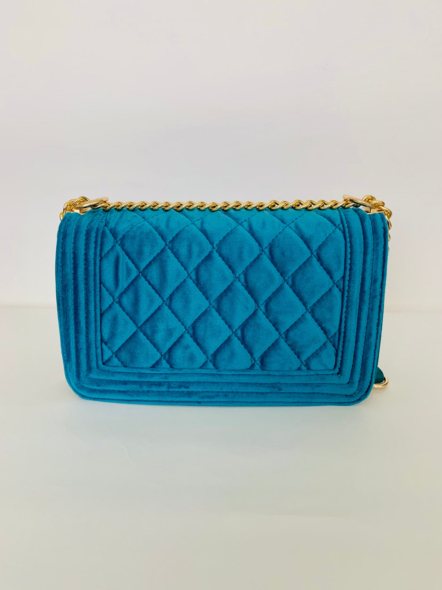 Teal Quilted Crossbody Handbag with Floral Embellishments