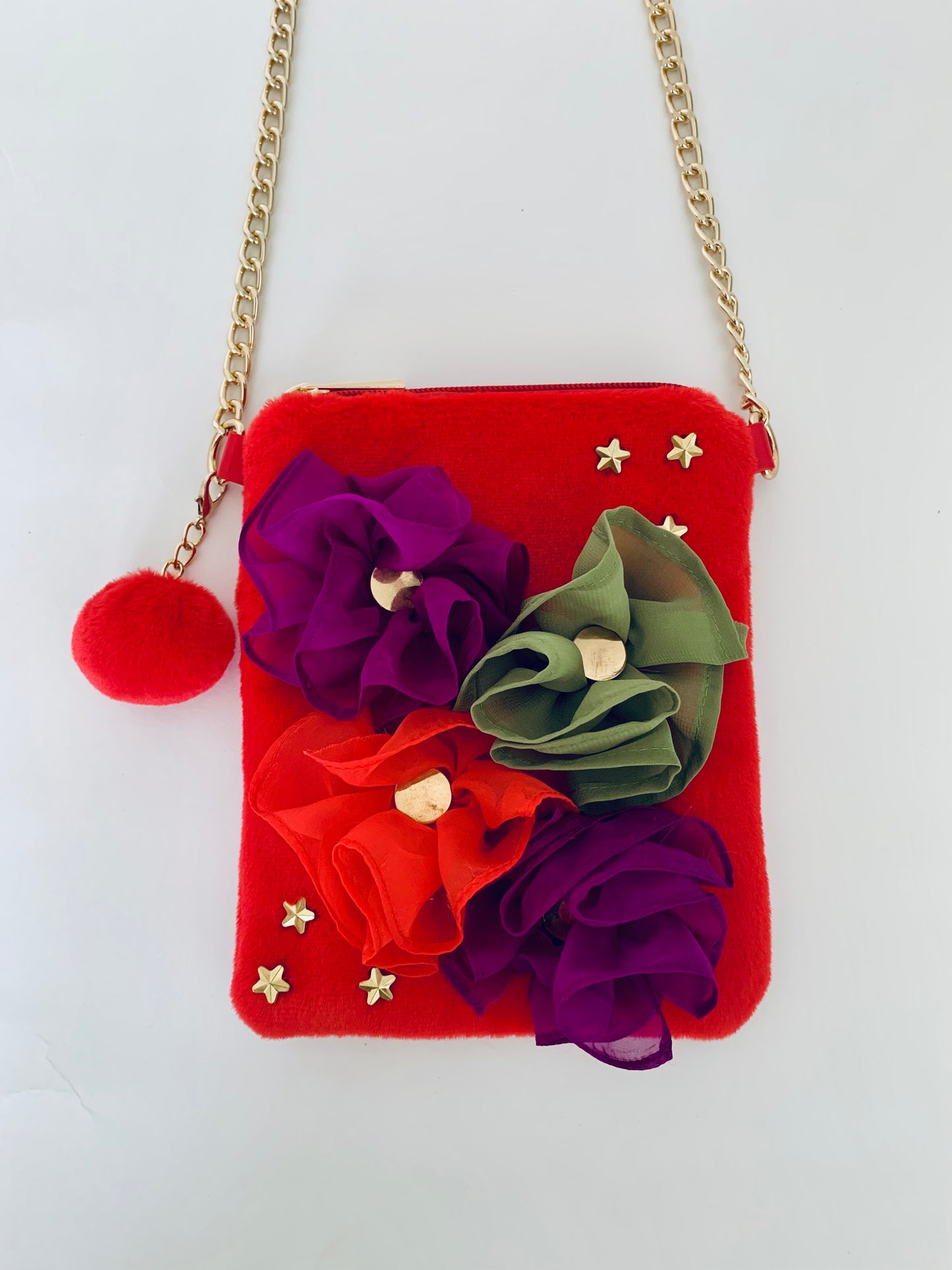 Red Crossbody Handbag with Floral Decorations and a Gold Chain